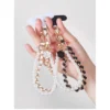 my-11134207-820l8-mearfyay0ikh37.webp Mobile Phone Case Accessories Double Chains With Pearls Wrist Strap Luxury Phone Leather Chains